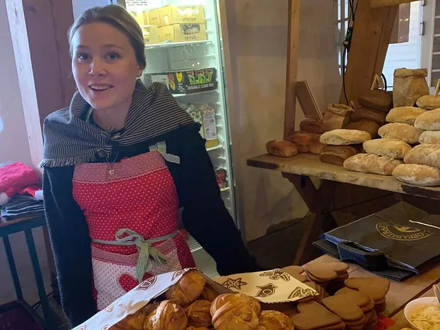 Kvinna i förkläde på bageri